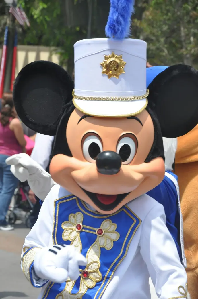 mickey mouse mascot in blue and white uniform